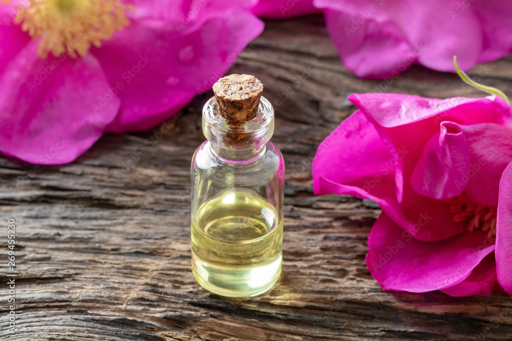 A bottle of essential oil with Rugosa roses A bottle of essential oil with Rugosa roses