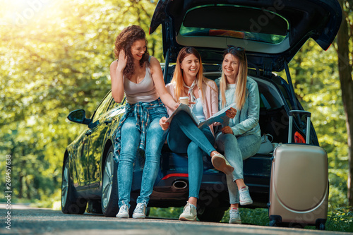 Three young girls going on vacation