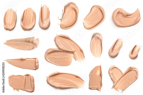 Light beige makeup smear of creamy foundation isolated on white background