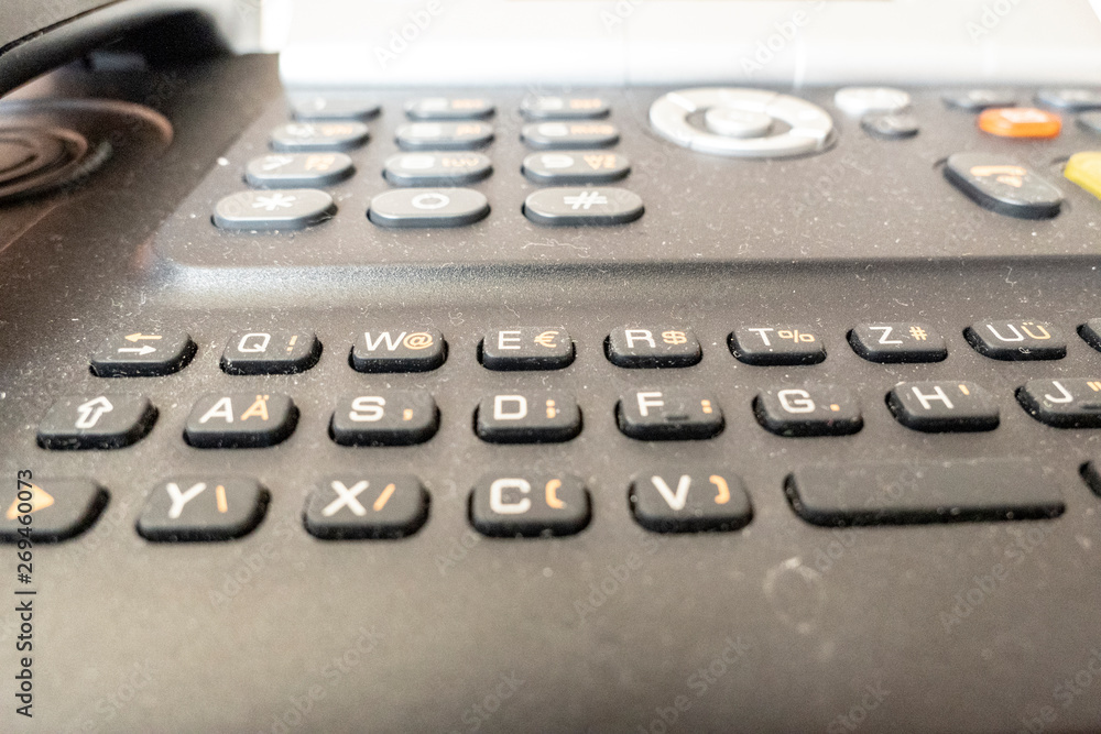 Telephone with buttons in the close-up view office Telephone with buttons in the close-up view office