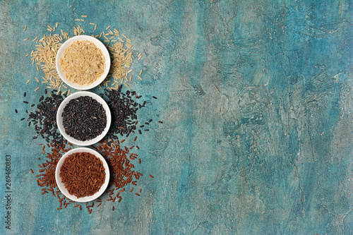 Bowls with black, white and brown or red rice