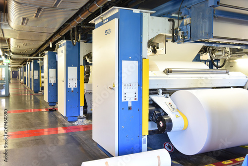 Printing shop: paper roll in a printing press
