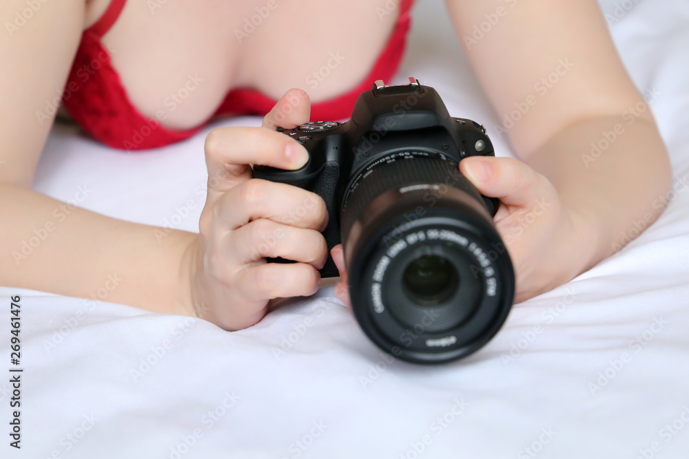 Hot woman in red bra lying with DLSR camera in the bed. Concept of adult  movies and photography, erotic shooting, girl photographer, sexy lingerie  Stock Photo | Adobe Stock