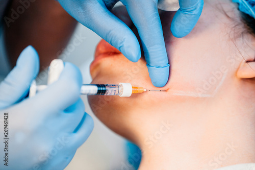 Contour correction is a procedure for filling wrinkles and restoring tissue volume - the doctor makes an injection of hyaluronic acid in the jaw area