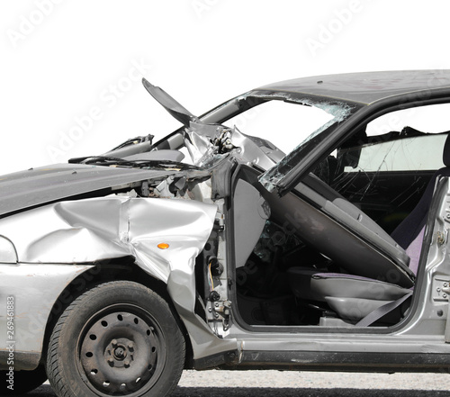 destroyed vehicle with broken windshield after the road accident