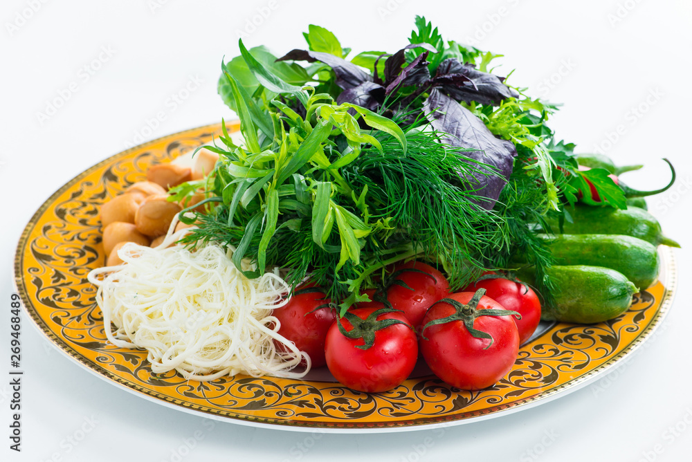 A plate of fresh Baku vegetables: tomatoes, cucumbers, greens, cabbage, cheese