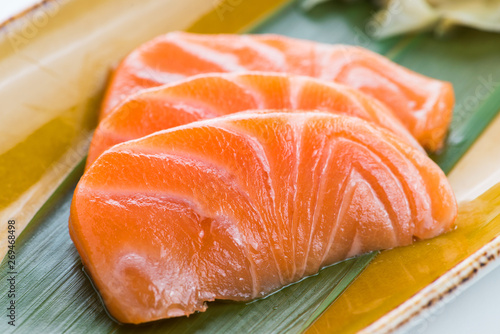 Three juicy fresh salmon pieces close up