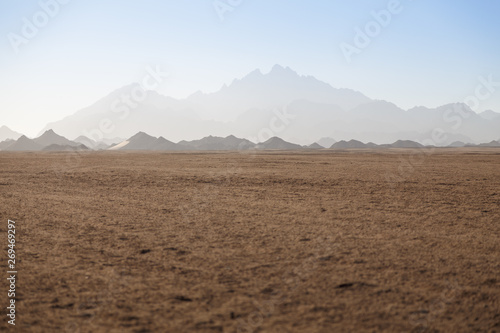 Synny noon with mountain view of desert near Hurghada, Egypt. Space for text
