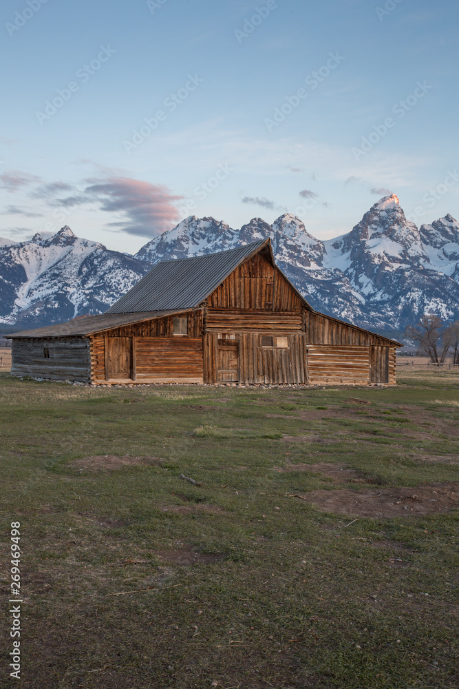 Infamous T.A. Moulton Barn during sunrise in Mormon Row, Grand Teton National Park, Wyoming.