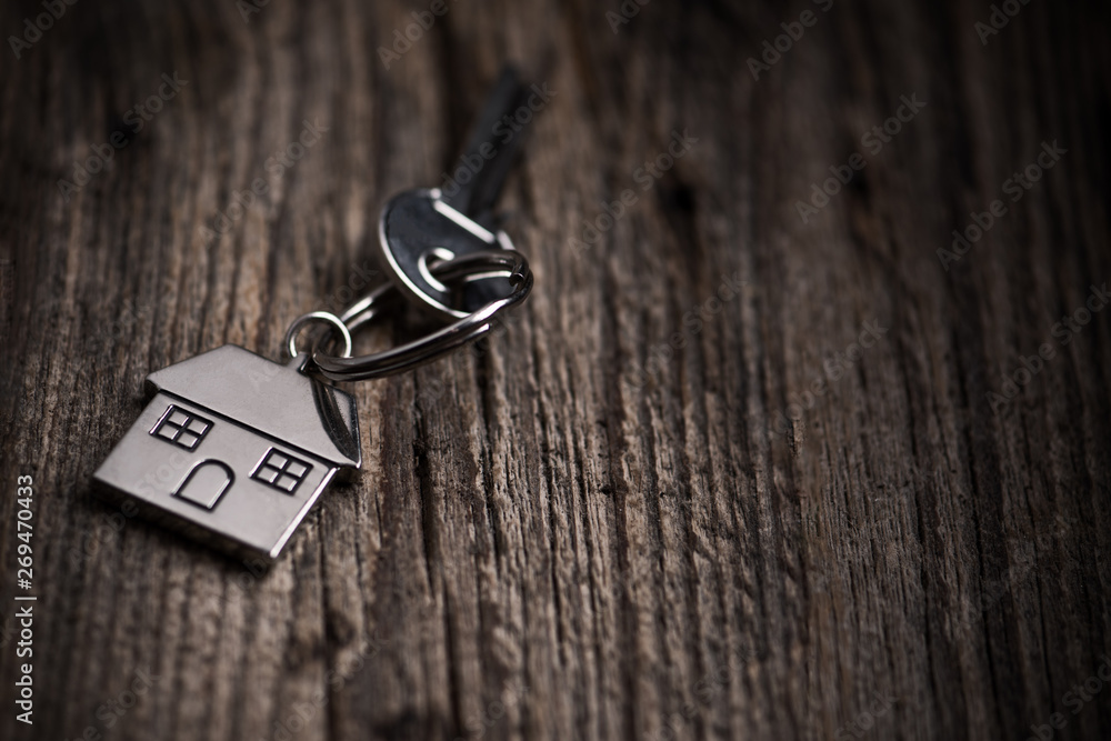 House key ring and old wood background House key ring and old wood background
