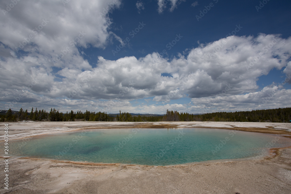 Colorful chemicals of the Opal Pool within the Grand Prismatic Spring walkway in Yellowstone National Park, Wyoming. Taken during the afternoon in mid-May. Colorful chemicals of the Opal Pool within the Grand Prismatic Spring walkway in Yellowstone National Park, Wyoming. Taken during the afternoon in mid-May.