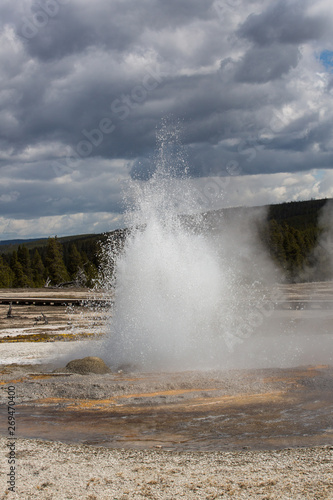 The Jewel Geyser erupting in Midway Geyser Basin  Yellowstone National Park  Wyoming. Taken during mid-May in the afternoon 
