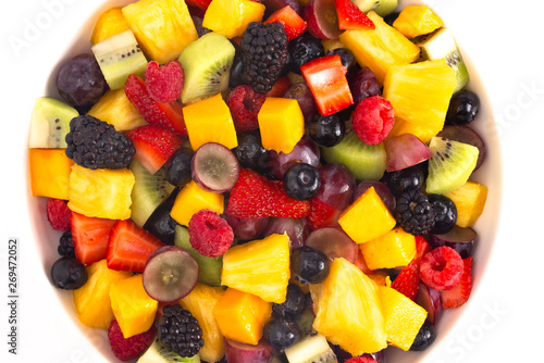 Bowl of Rainbow Colored Fruit Salad Isolated on a White Background