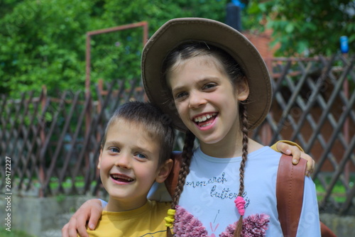 portrait of a boy and girl in the countryside
