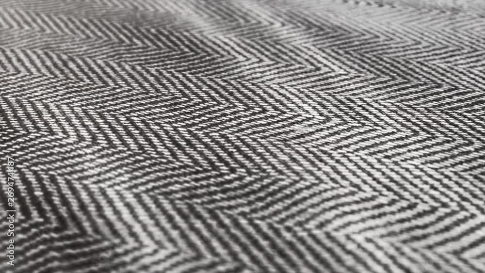 Herringbone background, macro shot of tweed fabric cloth waving. Herringbone background, macro shot of tweed fabric cloth waving.