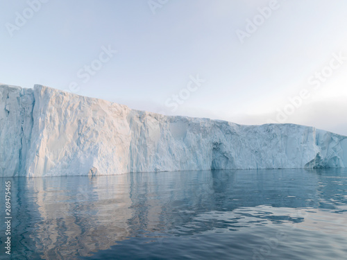 The glaciers are melting on arctic ocean in Greenland. Big glaciers day by day broking and dangerous for world climate system. Shooting day was foggy weather and glaciers didn't look clear. 