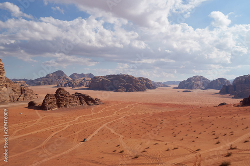 Panoramic view to the landscape of the Wadi Rum desert with red sand dunes and rocks in Jordan. 