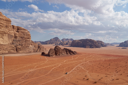 Panoramic view to the landscape of the Wadi Rum desert with red sand dunes and rocks in Jordan. 