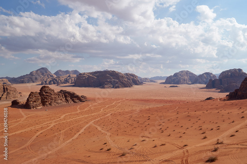 Panoramic view to the landscape of the Wadi Rum desert with red sand dunes and rocks in Jordan. 