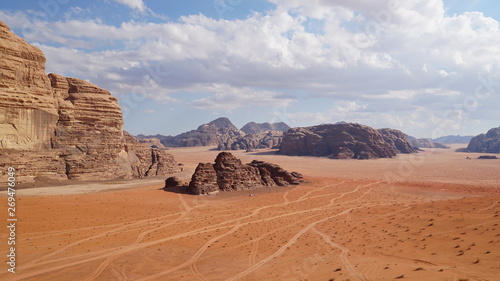 Panoramic view to the landscape of the Wadi Rum desert with red sand dunes and rocks in Jordan. 