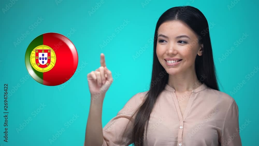 Beautiful female pushing Portuguese flag button, ready to learn foreign language Beautiful female pushing Portuguese flag button, ready to learn foreign language