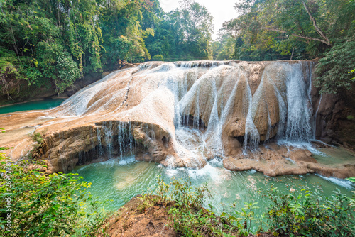 Fototapeta Naklejka Na Ścianę i Meble -  Panoramic view of the emerald waterfalls at Roberto Barrios in Chiapas, Mexico