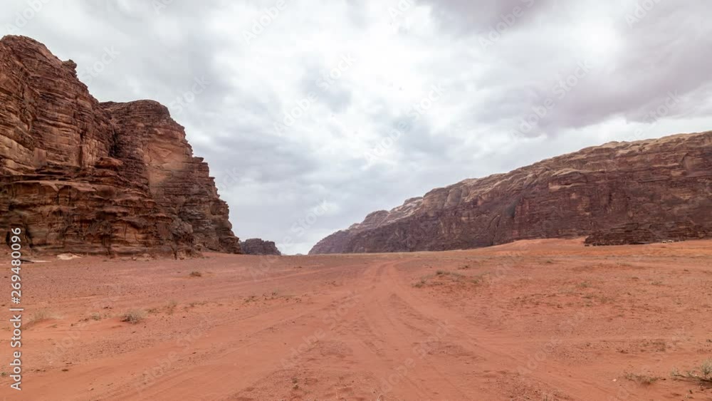 Clouds move fast over the red rocks. Stone desert landscape. Time lapse video. Clouds move fast over the red rocks. Stone desert landscape. Time lapse video.