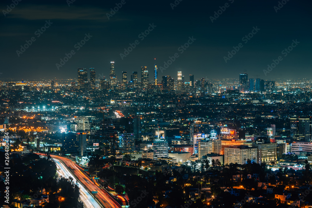 View of Hollywood and the Downtown skyline at night from the Hollywood Bowl Overlook on Mulholland Drive, in Los Angeles, California