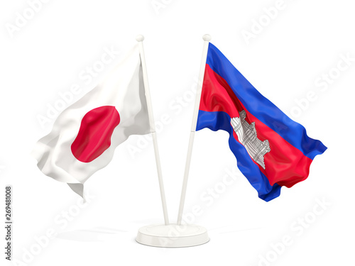 Two waving flags of Japan and cambodia isolated on white