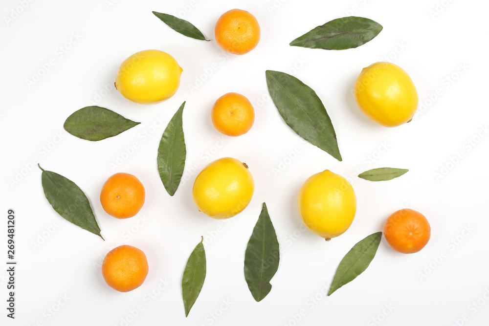 tangerines and lemons with leaves on a white background. tangerines and lemons with leaves on a white background.
