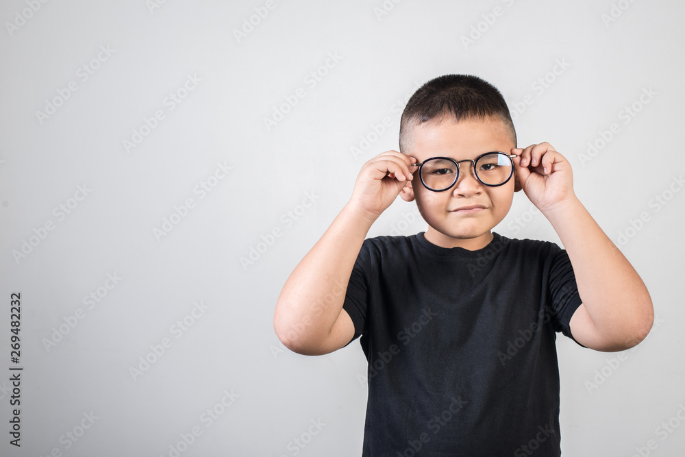 Funny boy genius wearing glasses in studio shot Funny boy genius wearing glasses in studio shot