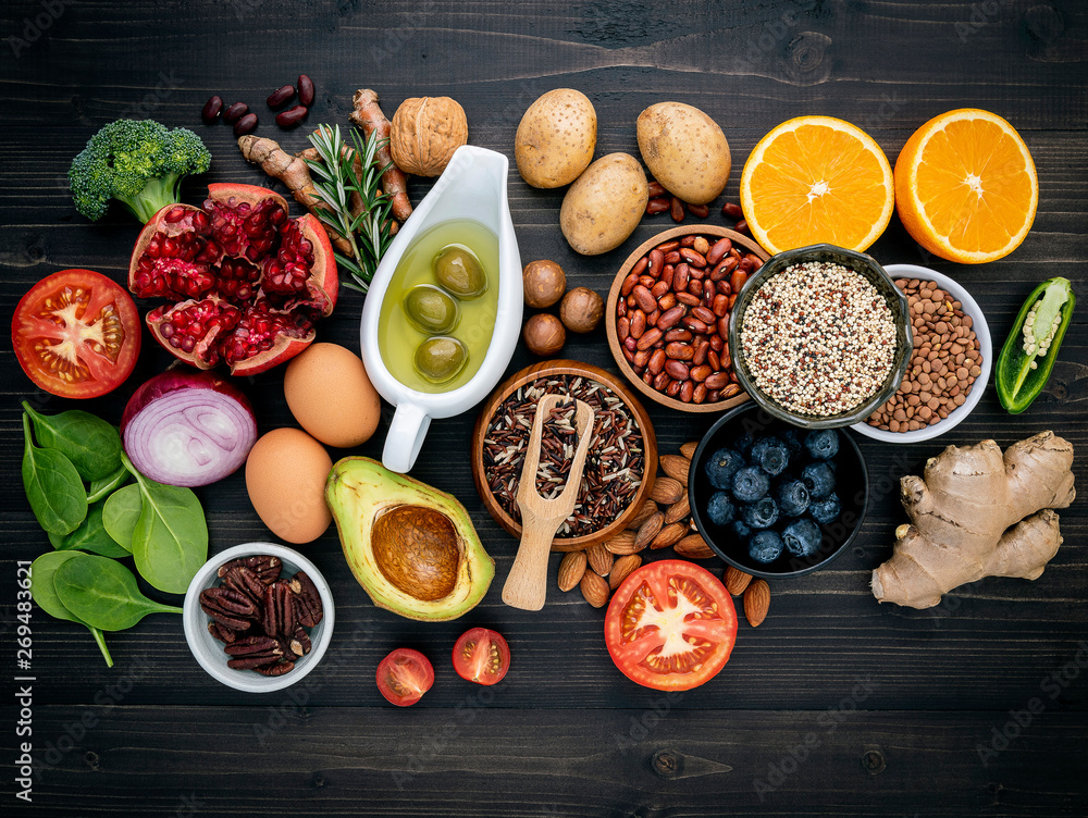 Ingredients for the healthy foods selection. The concept of healthy food set up on wooden background. Ingredients for the healthy foods selection. The concept of healthy food set up on wooden background.