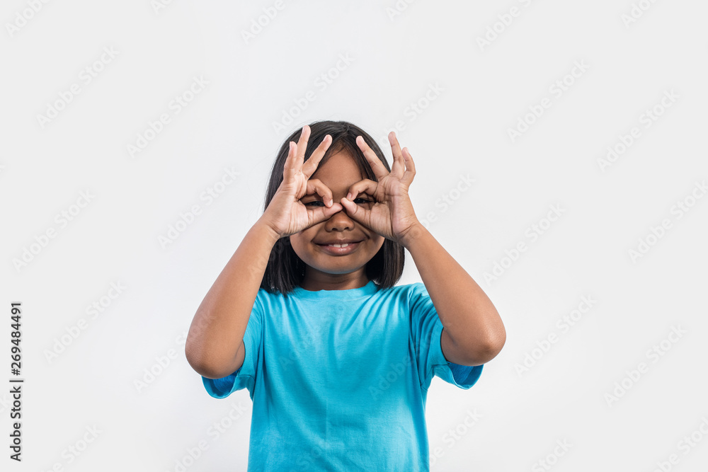 Portrait of Funny little girl acting in studio shot Portrait of Funny little girl acting in studio shot