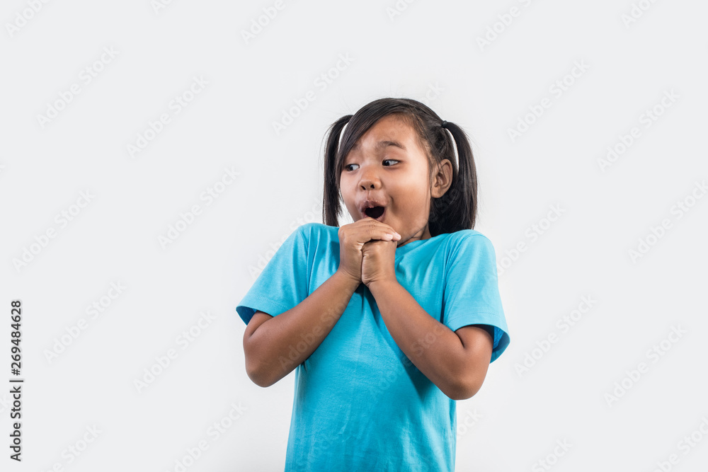 Portrait of Funny little girl acting in studio shot Portrait of Funny little girl acting in studio shot
