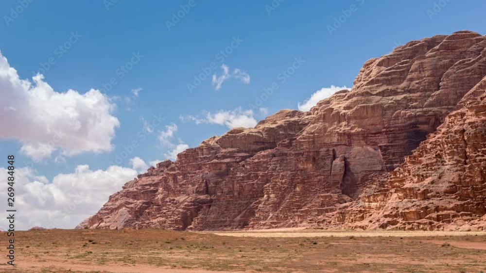 Stone desert landscape, white clouds move fast across the blue sky. Time lapse video Stone desert landscape, white clouds move fast across the blue sky. Time lapse video