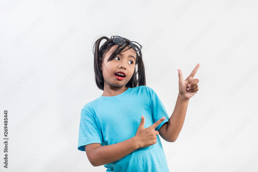 Portrait of Funny little girl acting in studio shot Portrait of Funny little girl acting in studio shot