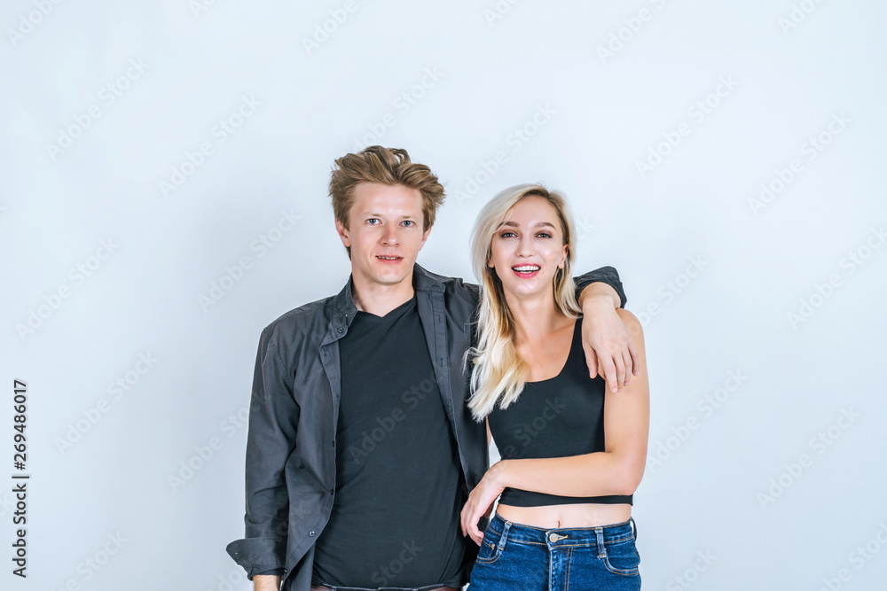 Portrait of happy young couple love together with flower in studio Portrait of happy young couple love together with flower in studio