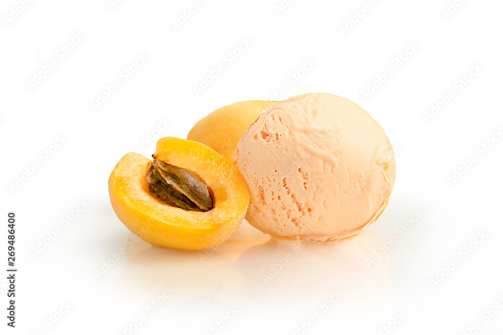 Ice cream ball, apricot flavor with ingredients, kiwi slices, isolated on a white background.