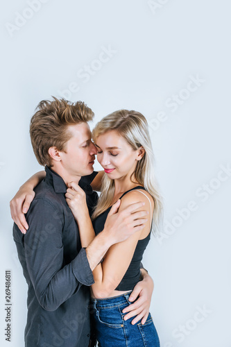 Portrait of happy young couple love together in studio