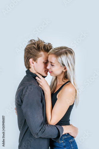 Portrait of happy young couple love together in studio