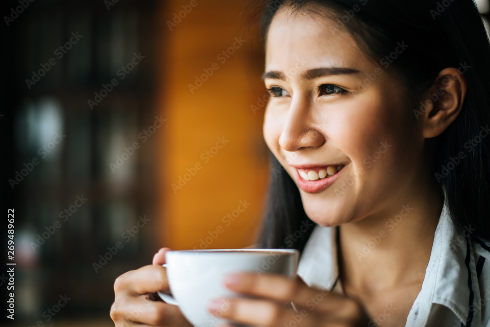 Portrait asian woman smiling relax in coffee shop cafe Portrait asian woman smiling relax in coffee shop cafe