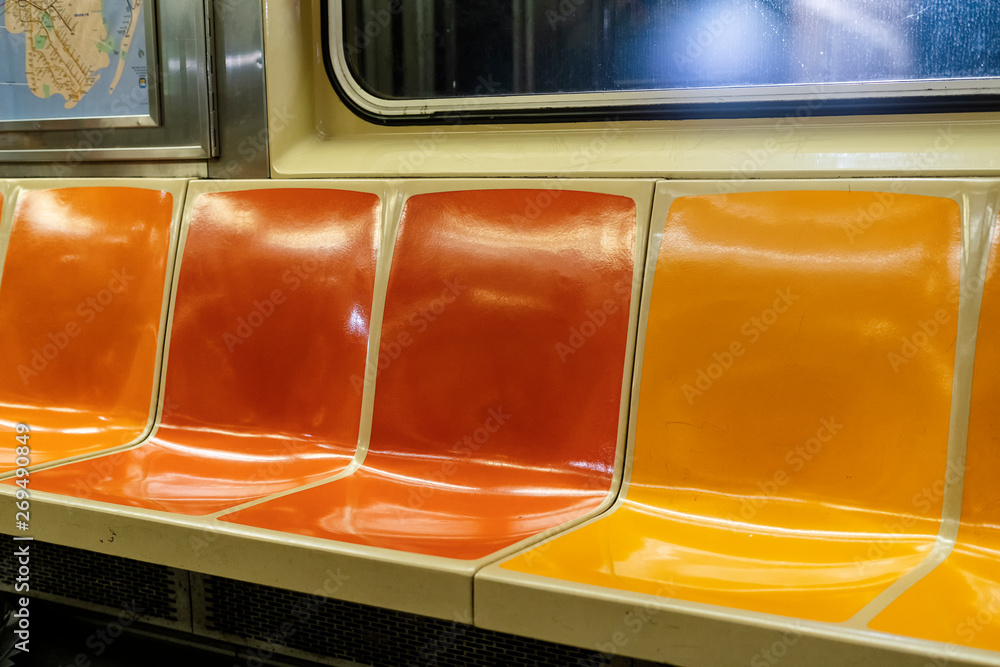 Colorful seats in a New York City subway car