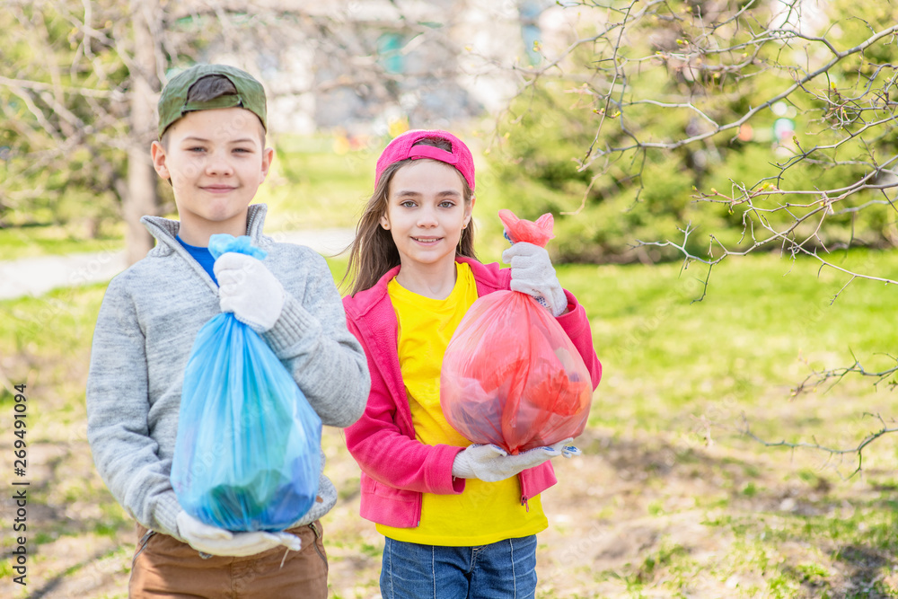 Young volunteers with garbage bags. Ecology concept. Empty space for text Young volunteers with garbage bags. Ecology concept. Empty space for text