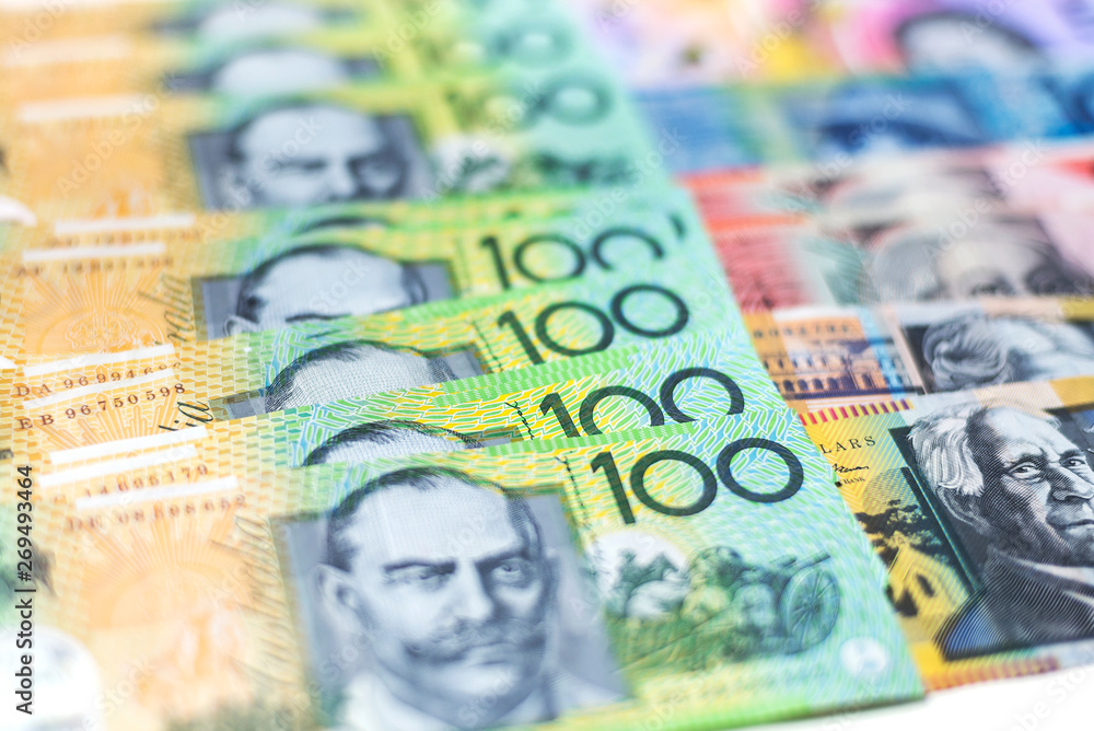 Fototapeta premium Australian 100 dollar notes closeup with white background.
