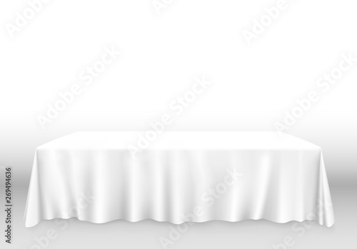 Table with tablecloth art banner, white background.