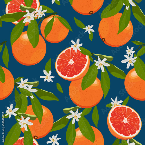 Seamless pattern orange fruits with flowers and leaves on blue background. Grapefruit vector illustration.