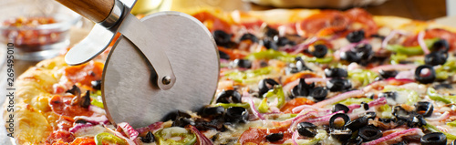 tasty supreme pizza with olives peppers onions and sausage panorama