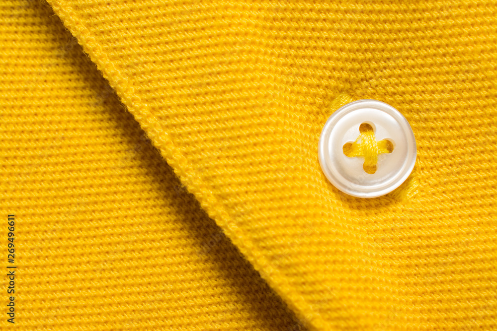 Yellow polo shirt texture, cotton fabric. Textile background Yellow polo shirt texture, cotton fabric. Textile background