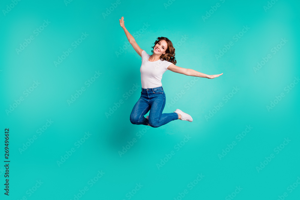 Full length body size view of her she nice-looking attractive lovely winsome cheerful cheery wavy-haired lady having fun like plane wings isolated on bright vivid shine blue background