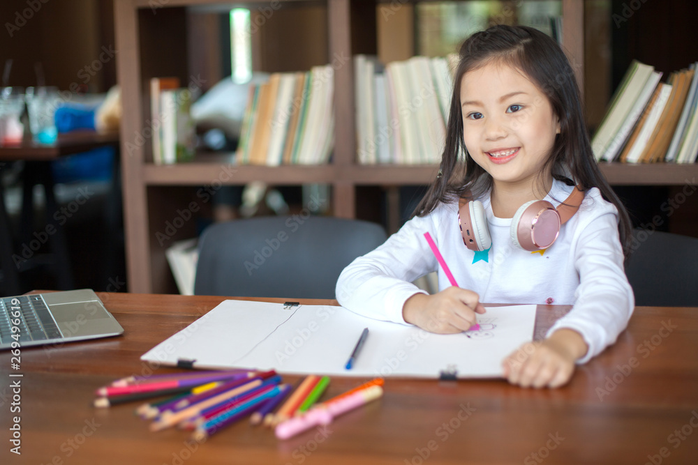 Asia little student girl studying and reading book at school - education and school concept Asia little student girl studying and reading book at school - education and school concept